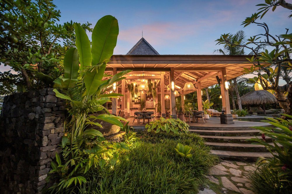 Stone pathway winding between the villas