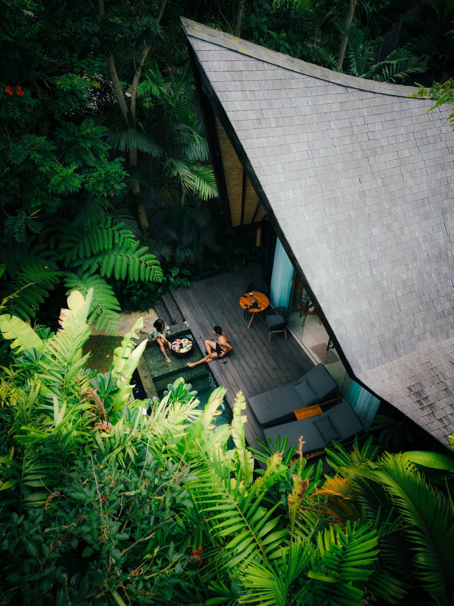Interior of the Premium Jabu with floor-to-ceiling windows onto the garden