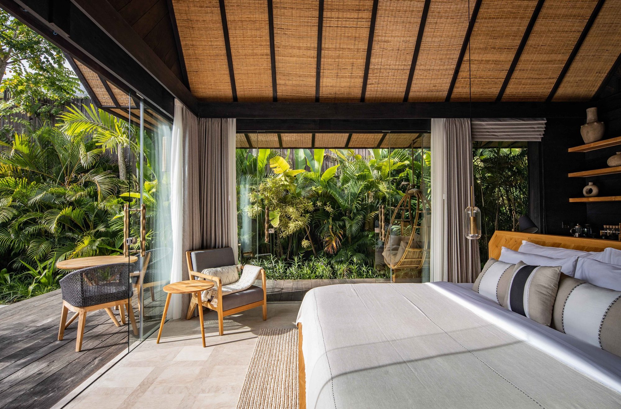 Premium Jabu bedroom opening onto the terrace and jungle garden