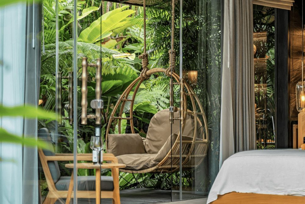 Hanging rattan swing chair on the Premium Jabu terrace